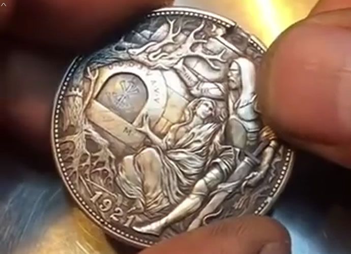 The 1921 dollar coin actually has a little mechanism